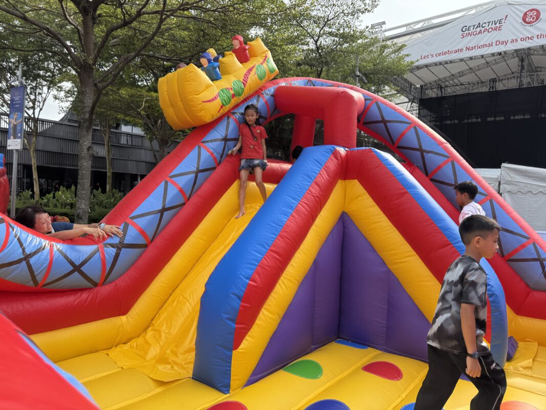 Theme park bouncy with people